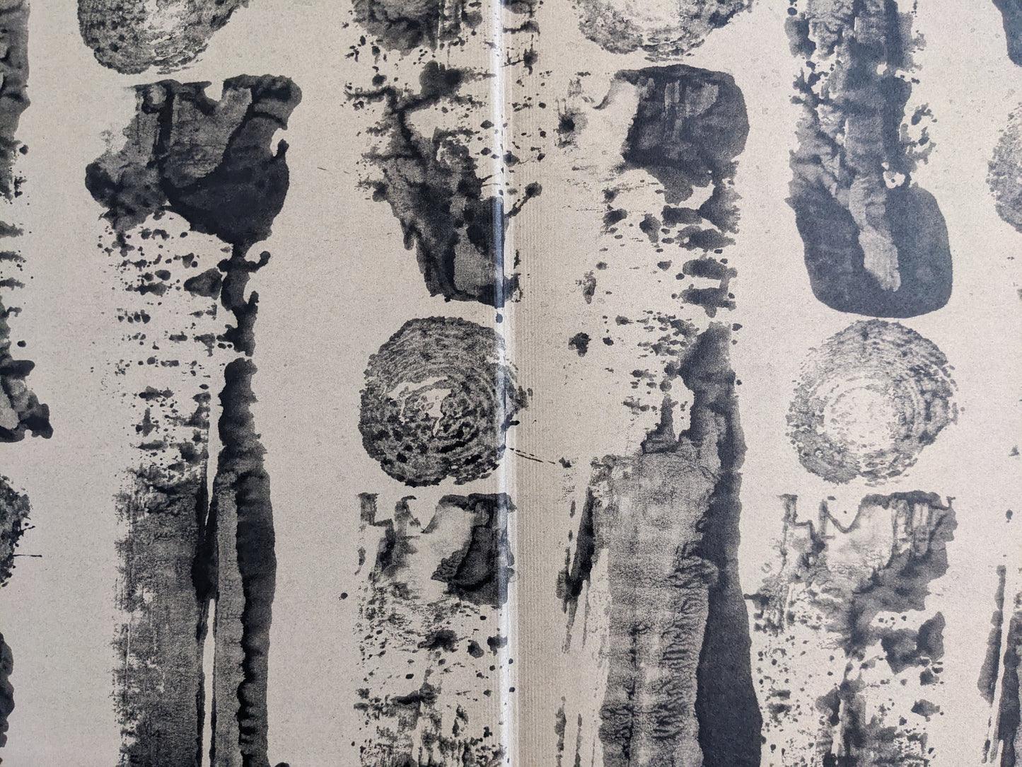 Endpaper of The Pillar by Stephen Gill, abstract black ink tree ring and bark patterns on beige background