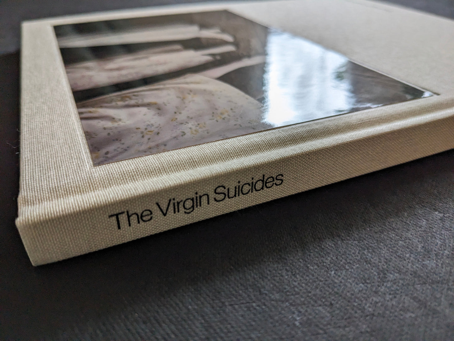 Close-up of the spine and clothbound cover of The Virgin Suicides book by Sofia Coppola.