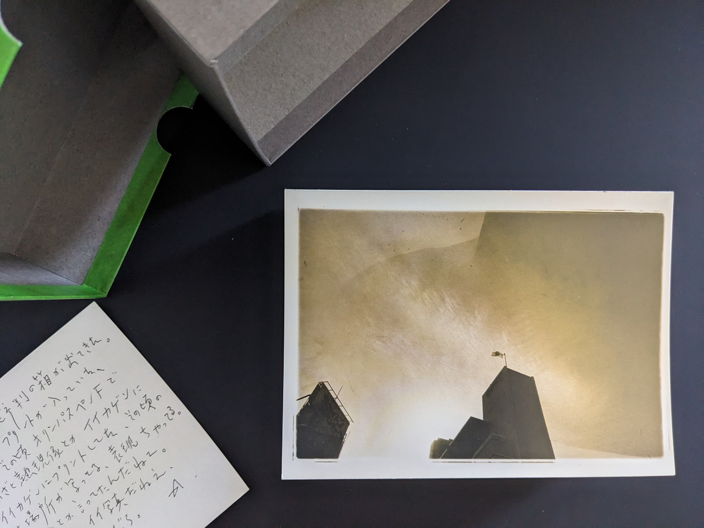 Color-toned print of a house with a flag, included in Nobuyoshi Araki’s Theater of Love