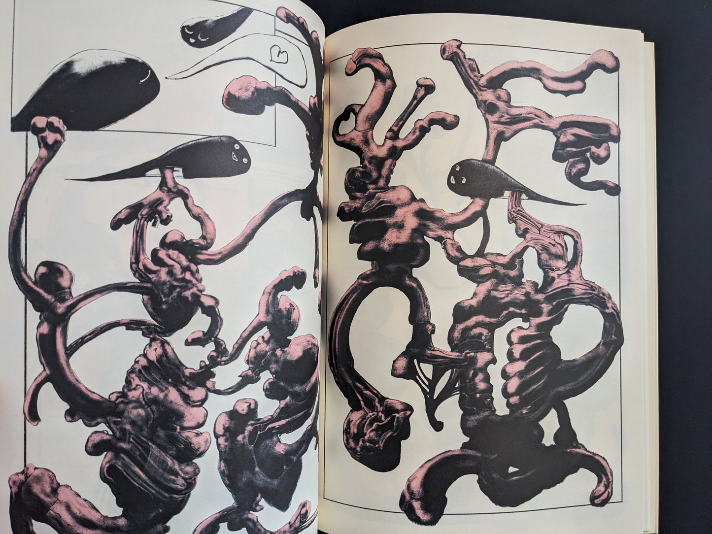 Black tadpole-like figures floating among twisted red fleshy structures.