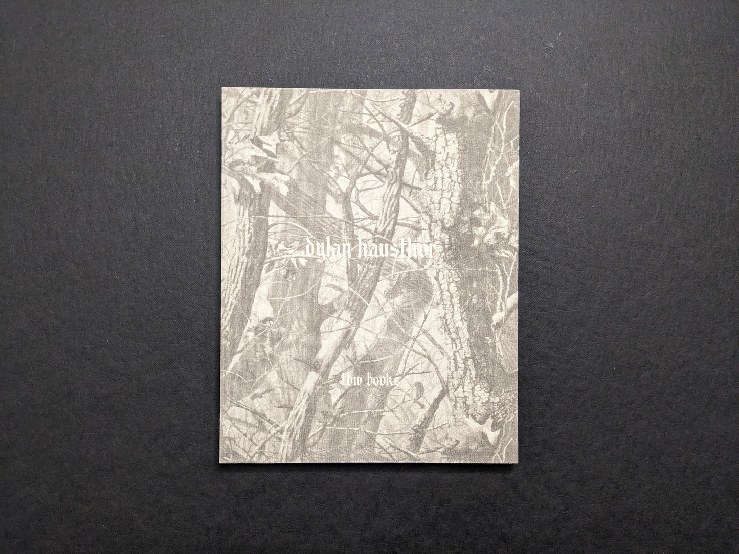 Back cover with woodland texture, author name, and the TBW Books imprint.