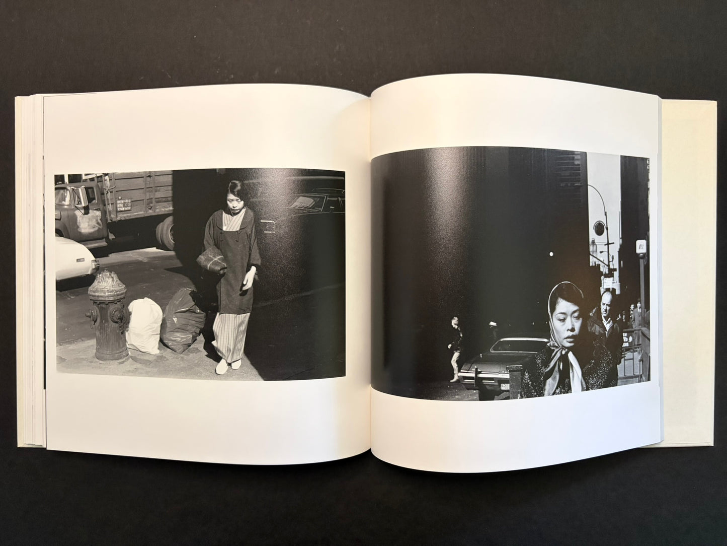 Open spread with a woman in a narrow street on the left and a close portrait in the dark on the right.