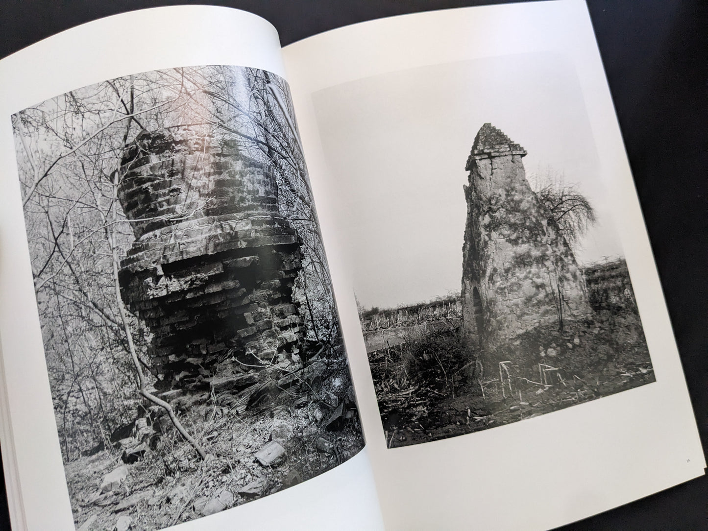 Interior spread from The Ancient Towers by Zhang Yu-Ming, showing decayed Buddhist stone towers in rural China.