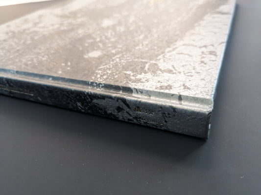 Close-up of the spine of Daido Moriyama’s photobook 1980s Remnants published by Sokyusha