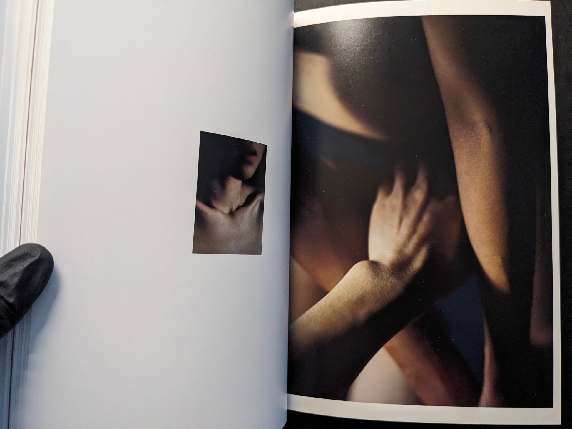 Interior spread with a small portrait inset beside a blurred close-up of intertwined bodies.