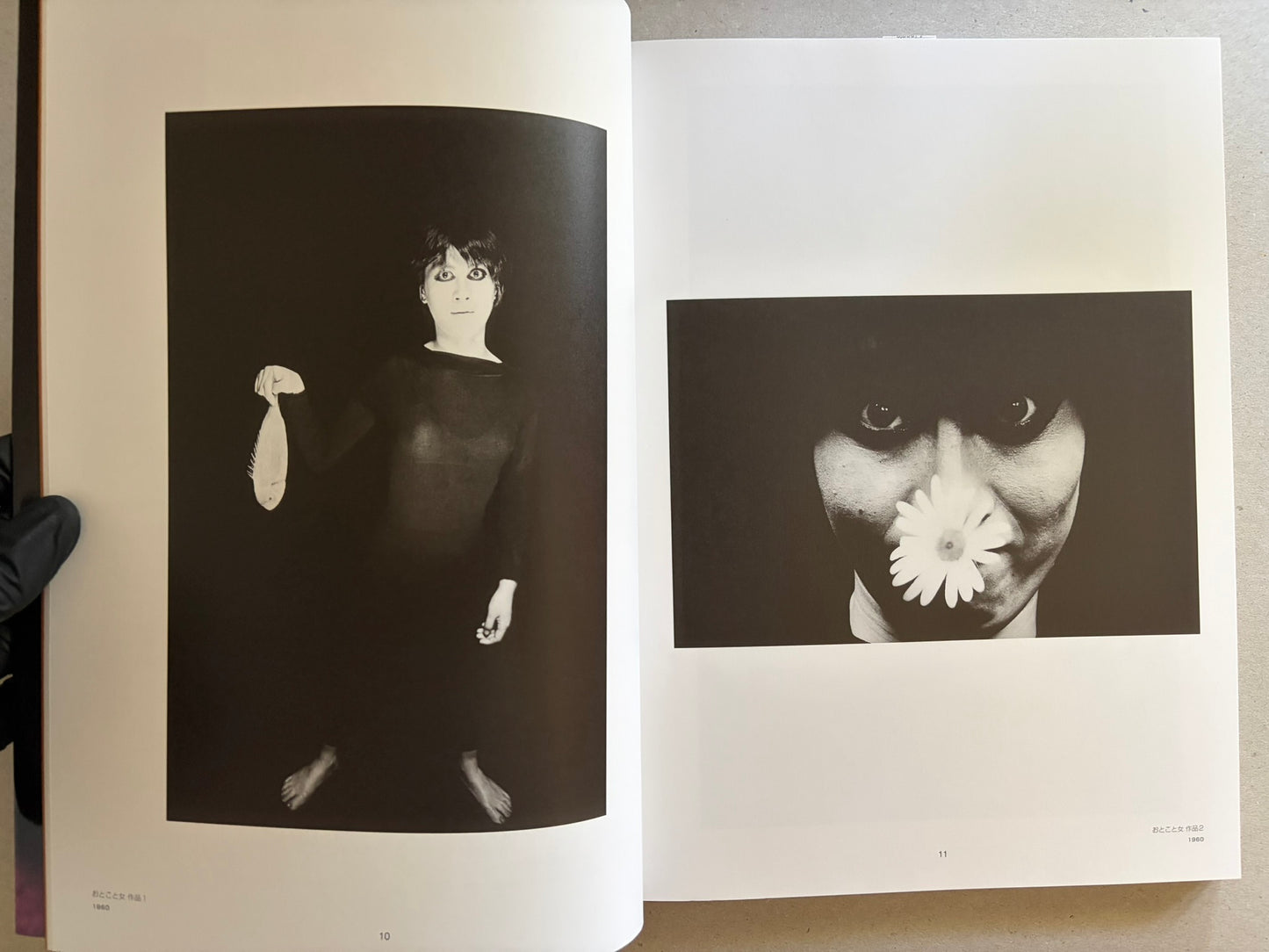 Two-page spread with black-and-white portrait photographs, including a full-length figure holding a fish and a close-up face with a flower.
