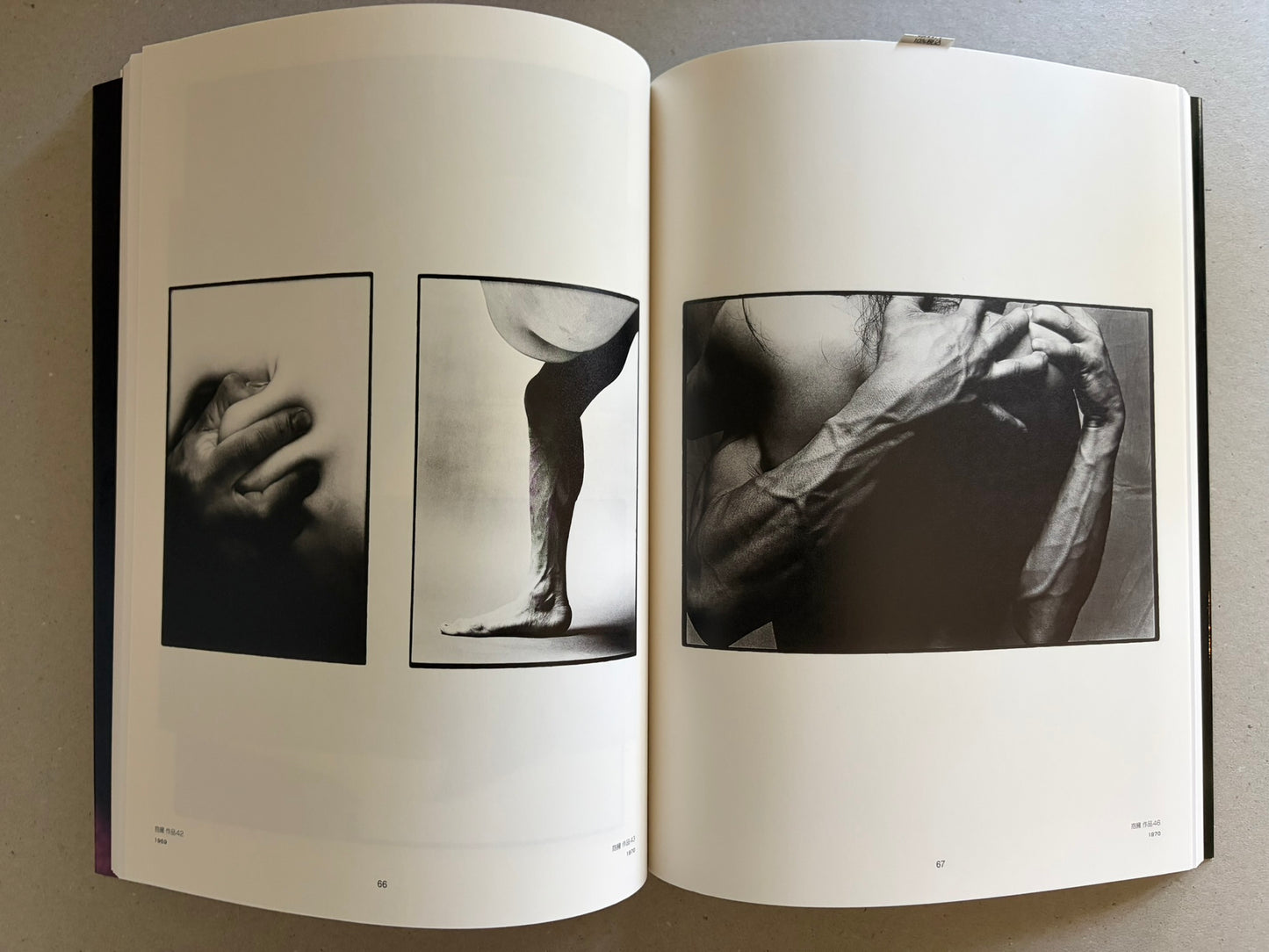 Two-page spread with three monochrome studies of hands, a leg, and an upper body in close-up.