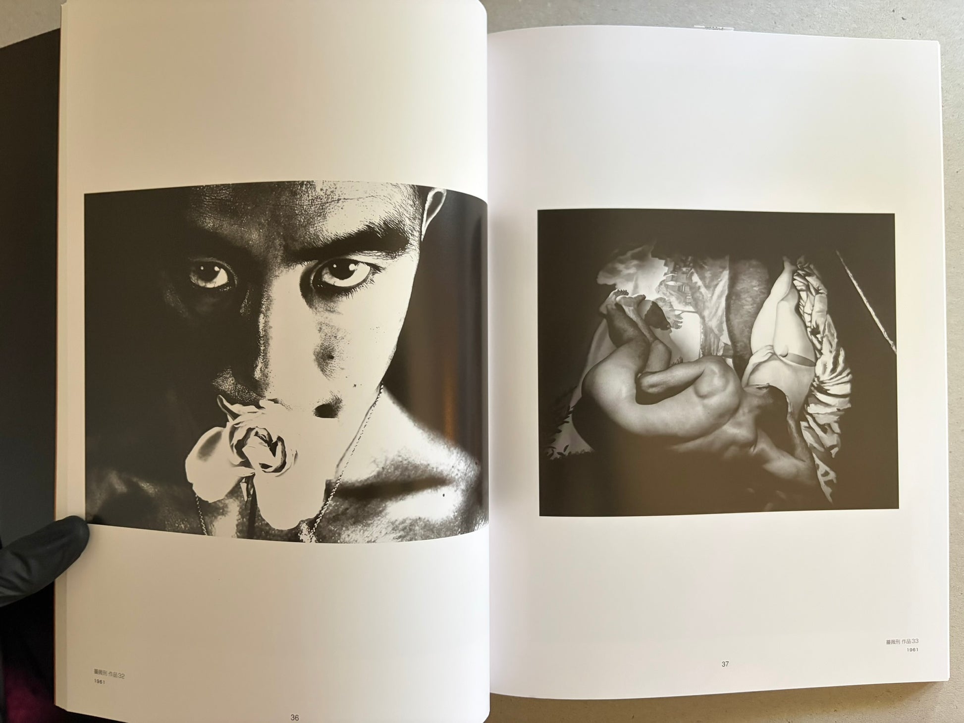 Two-page spread with black-and-white portraits and a staged figure in patterned clothing, one image showing a flower at the mouth.