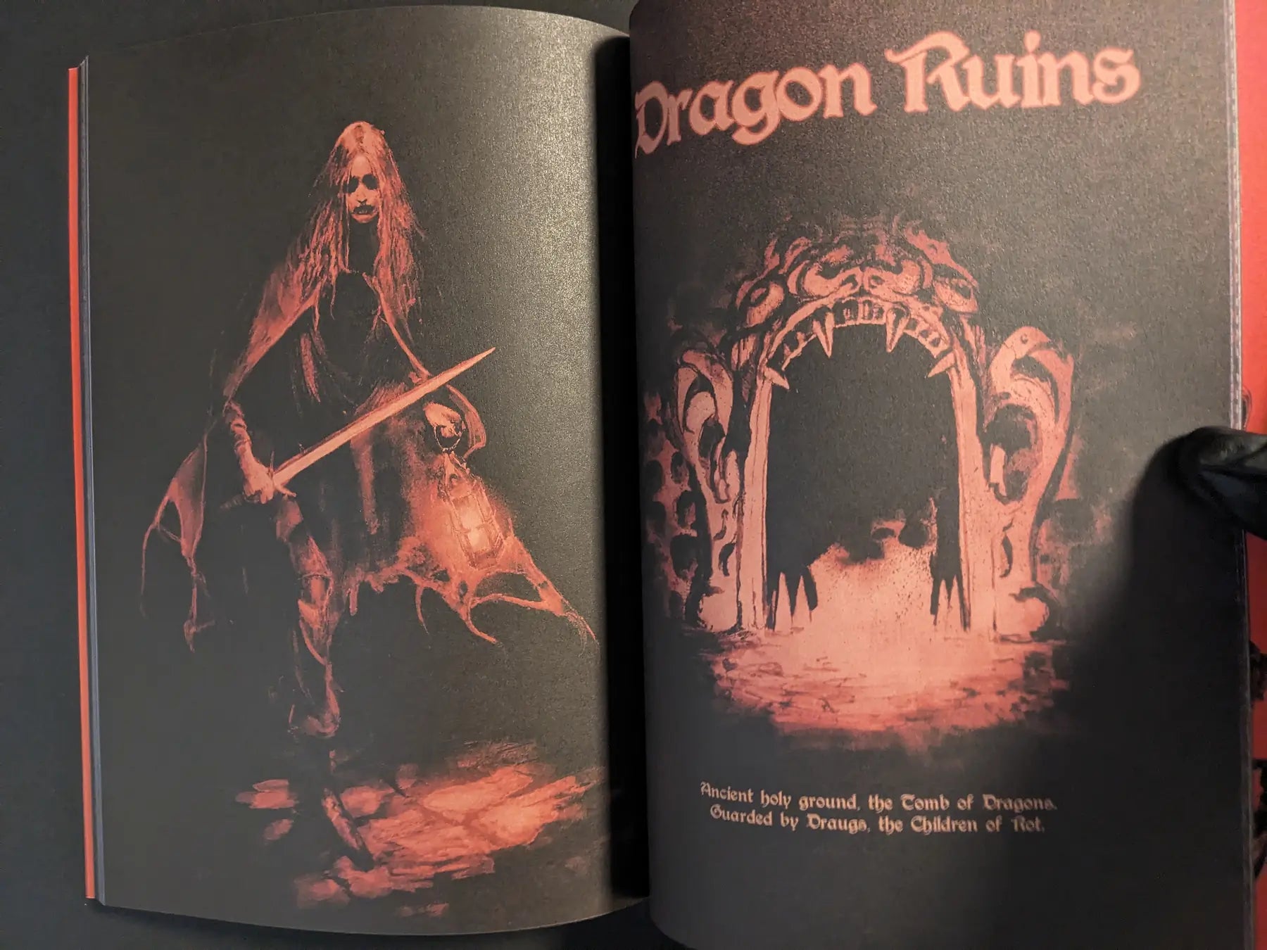 Interior spread titled Dragon Ruins, showing a cloaked adventurer and a fiery dungeon entrance shaped like a beast’s jaws.