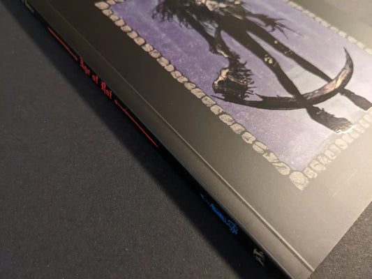 Angled view of the softcover reprint, showing the illustrated front cover and printed spine.