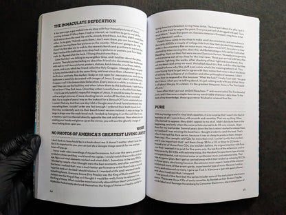 Interior spread showing the sections The Immaculate Defecation and Pure.