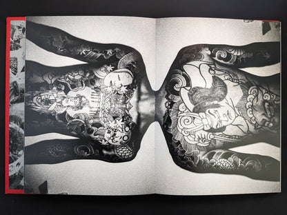 Close-up of a full-back Japanese tattoo featuring mythological figures.