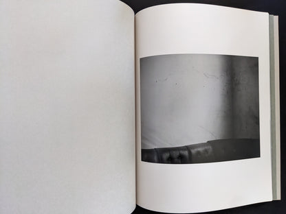 Photograph from Ash (New Edition) by Muge, minimalist black-and-white still life with sofa backrest.