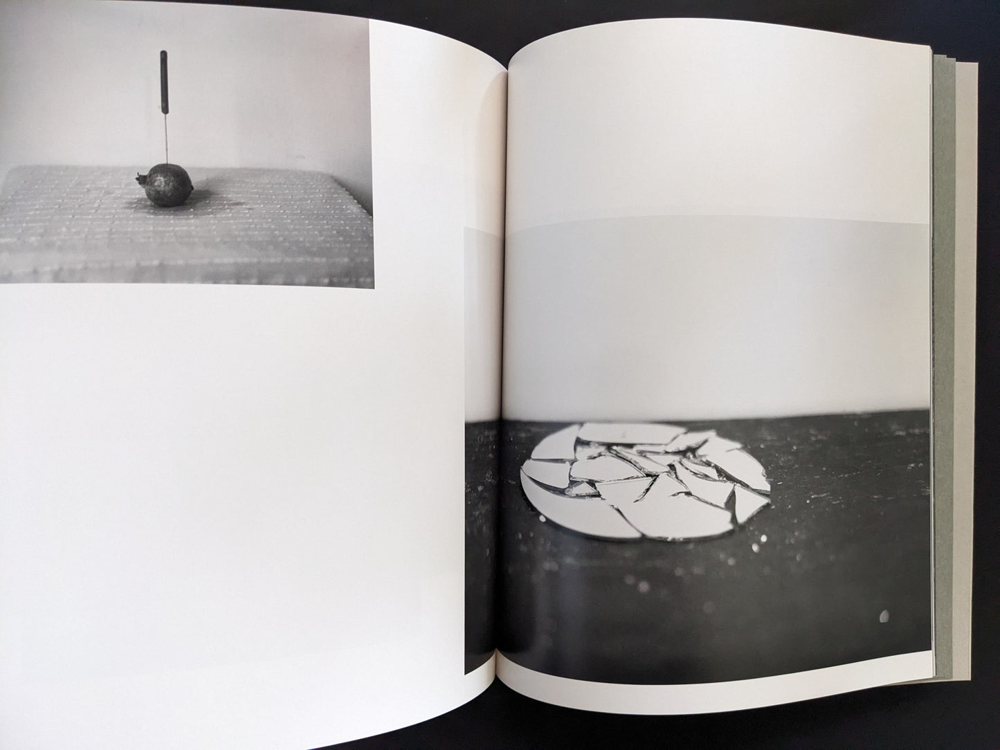Open spread from ASH (New Edition) by Muge, with a knife in fruit and broken ceramic plate composition.