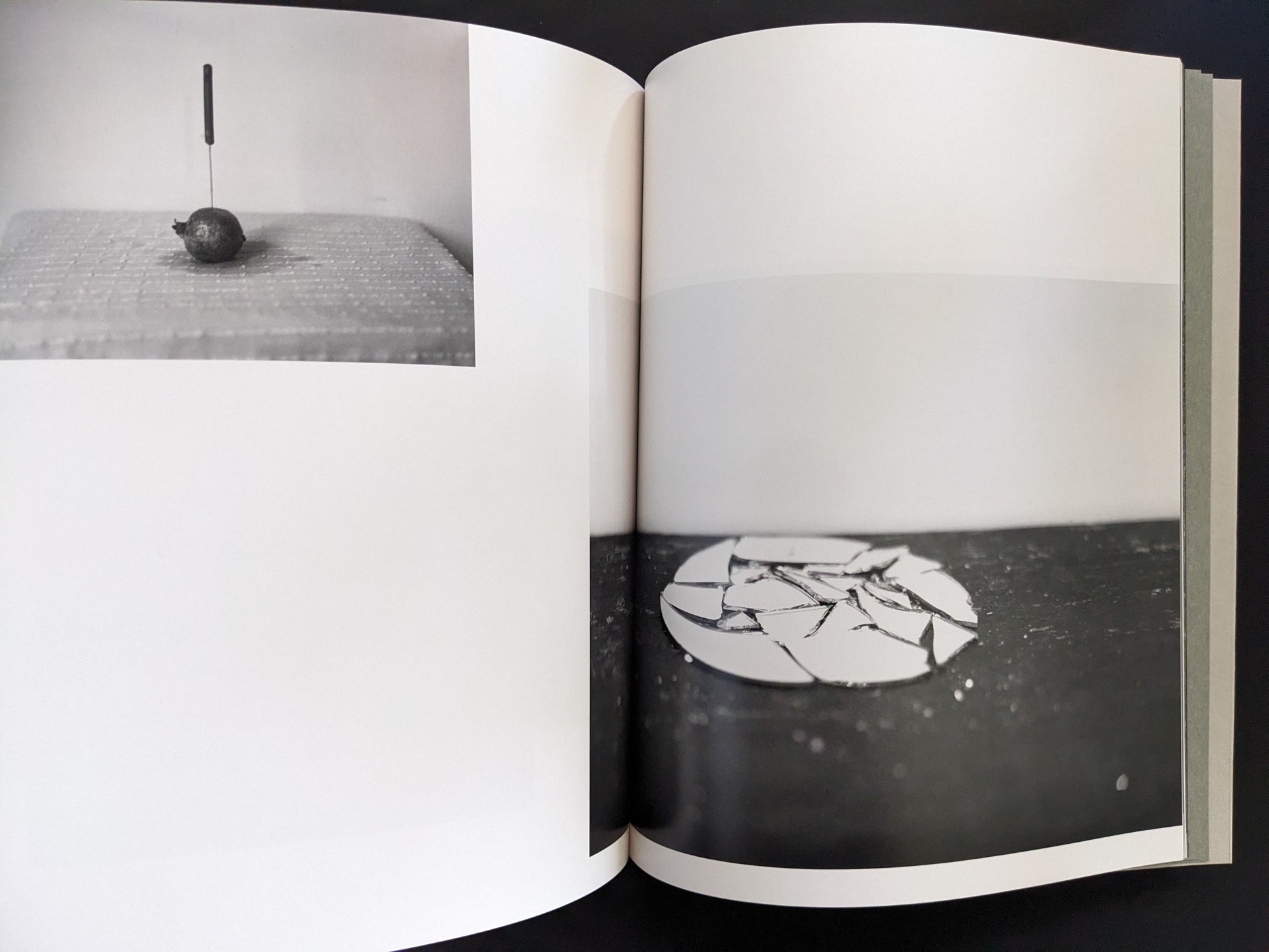 Open spread from ASH (New Edition) by Muge, with a knife in fruit and broken ceramic plate composition.