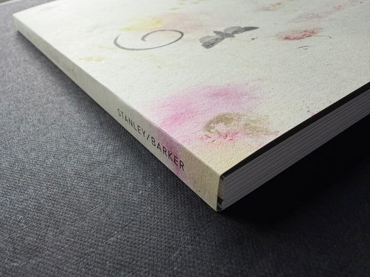 At Night Gardens Grow by Pia-Paulina Guilmoth, angled view of the front cover and spine with STANLEY/BARKER visible