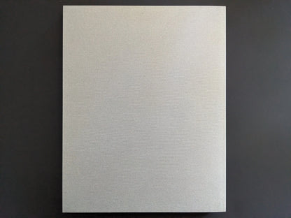 Back cover of Symphony – mushrooms from the forest by Takashi Homma with plain grey textile softcover