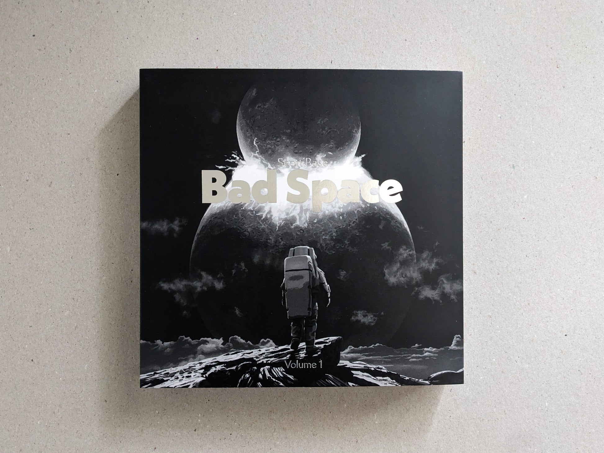 Front cover of Bad Space Volume 1 by Scott Base, with hot silver stamping on the softcover.