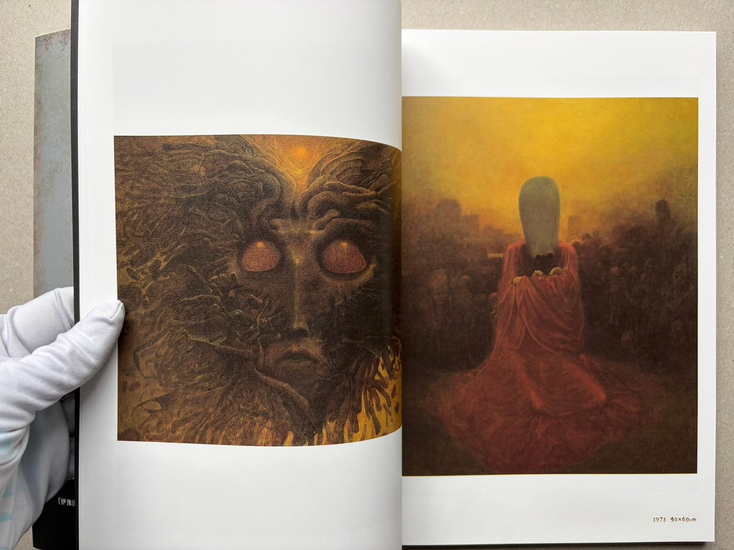 Open spread from Beksinski - The Collected Works I ver. 1.2 with two surreal colour paintings, including a masked figure and a red-robed figure.