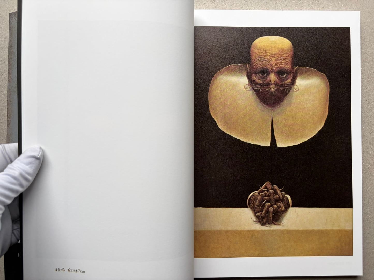 Open spread from Beksinski - The Collected Works I ver. 1.2 with two colour paintings, one on each page.