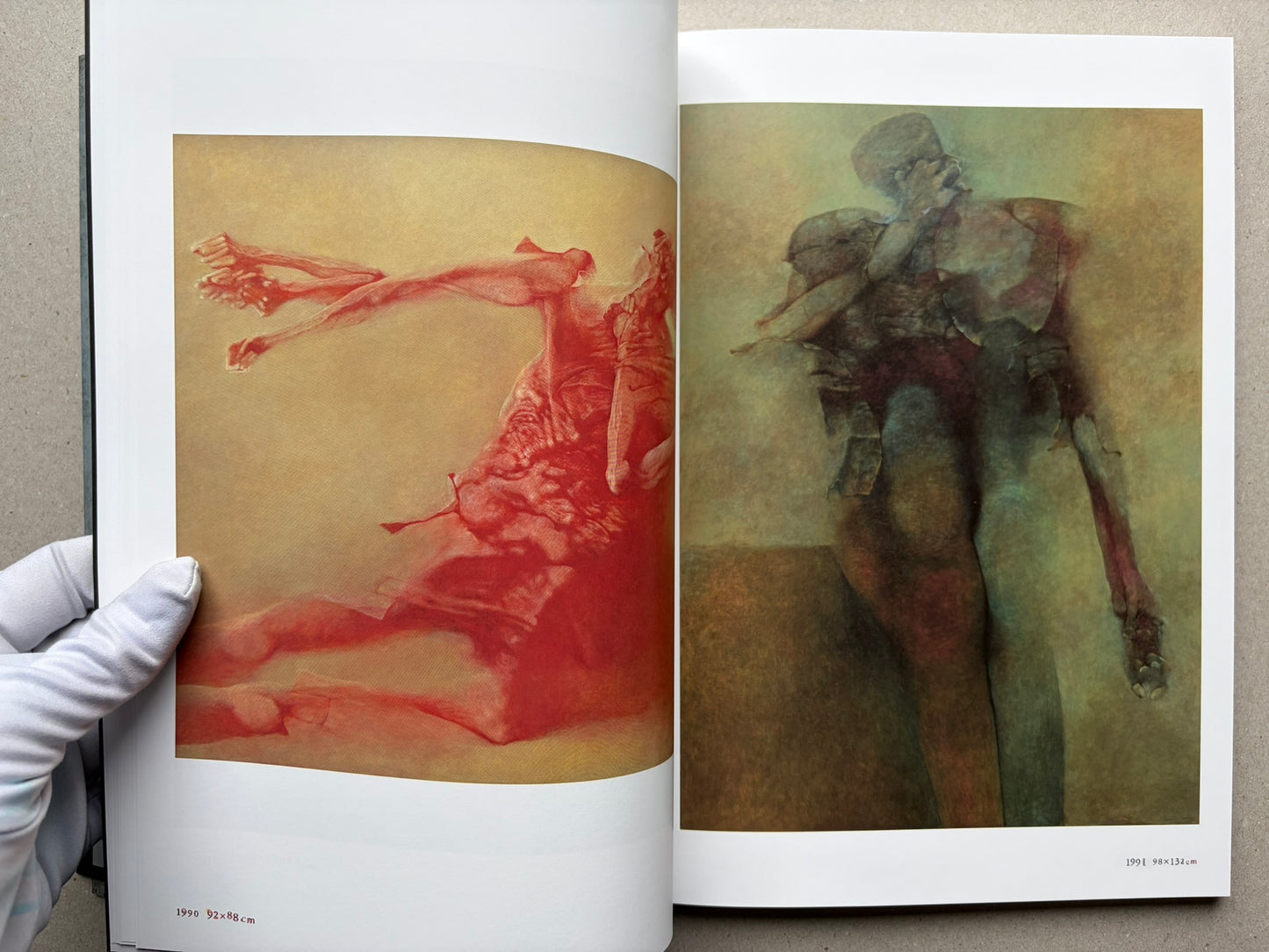 Beksiński: The Collected Works II ver. 1.2 open to two paintings across a spread.