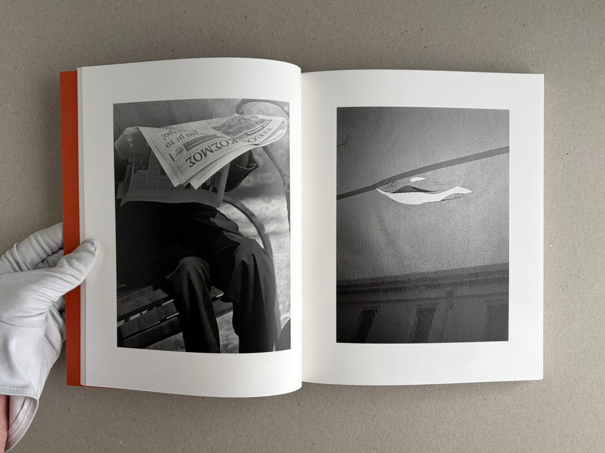 Open spread of between the skin and sea by Katrin Koenning, showing two black-and-white photographs on white pages.