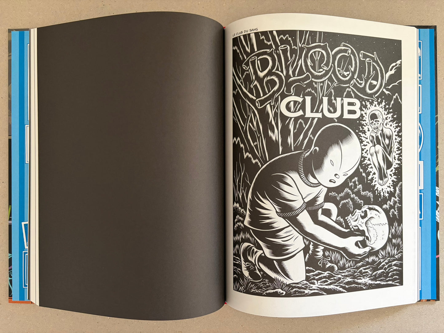 Open spread from Big Baby with a child holding a skull beside the title Blood Club.