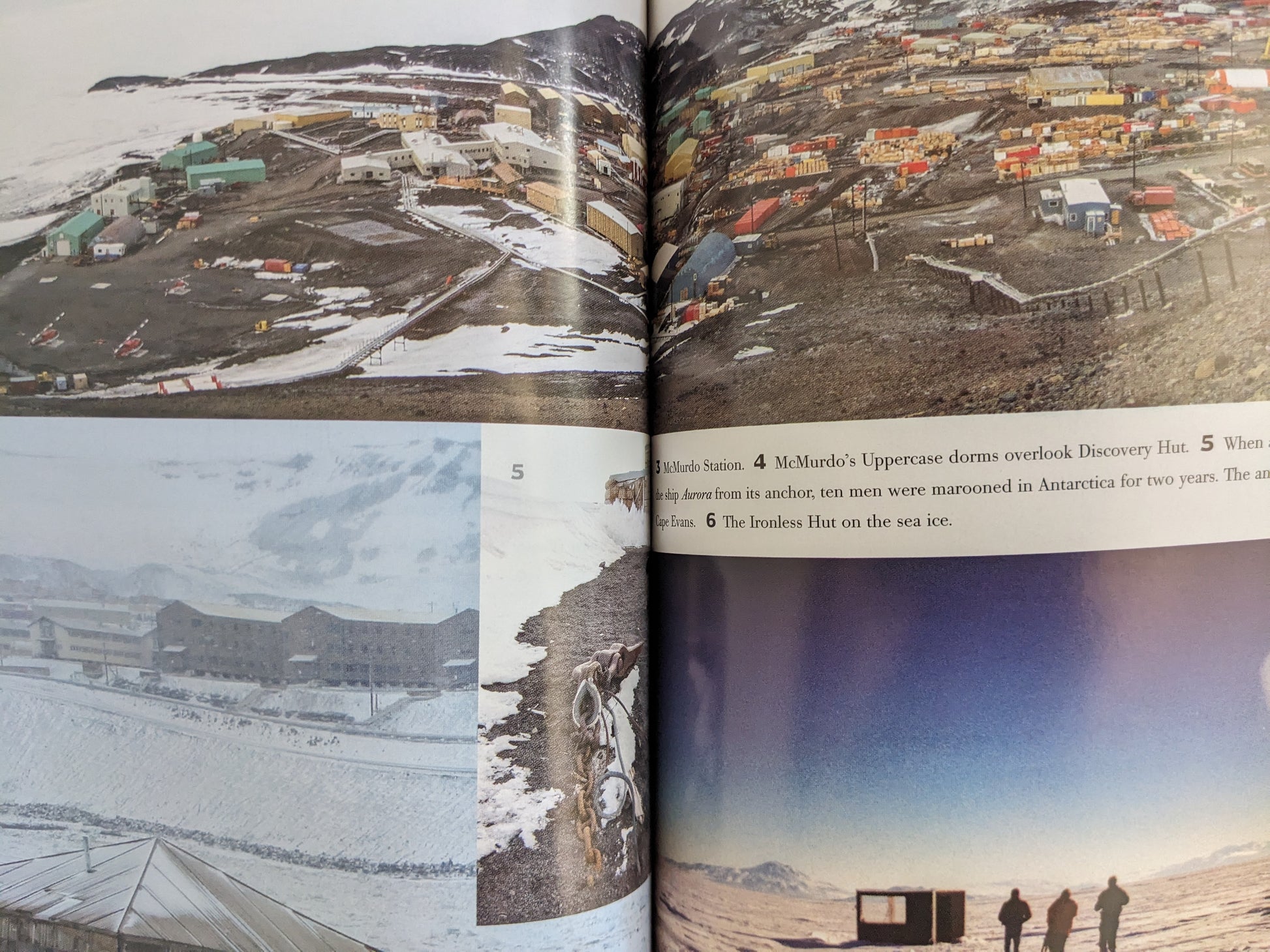 Full-color photo spread from "Big Dead Place" showing aerial and ground views of McMurdo Station in Antarctica