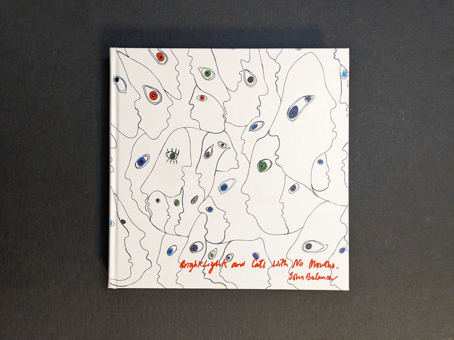 Front cover of Bright Lights and Cats with No Mouths by John Balance, with abstract faces and eye motifs.