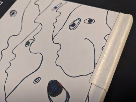 Detail of the book spine repaired with white cloth tape.