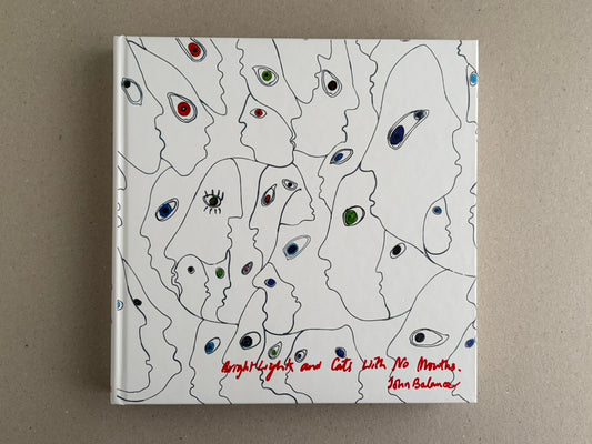 Bright Lights and Cats with No Mouths hardcover front cover with white background, line-drawn faces, and red handwritten title and John Balance signature.