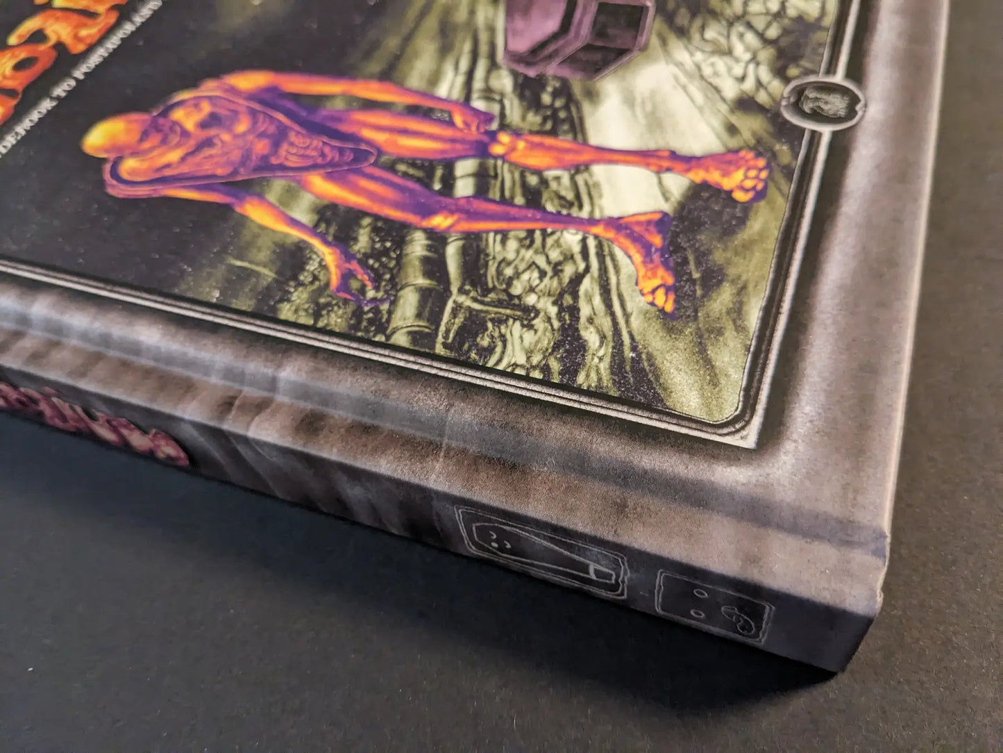 Close-up of the hardcover spine of “Bubzium – the guidebook to postapoland” by Bartosz Zaskorski, published by Hollow Press.