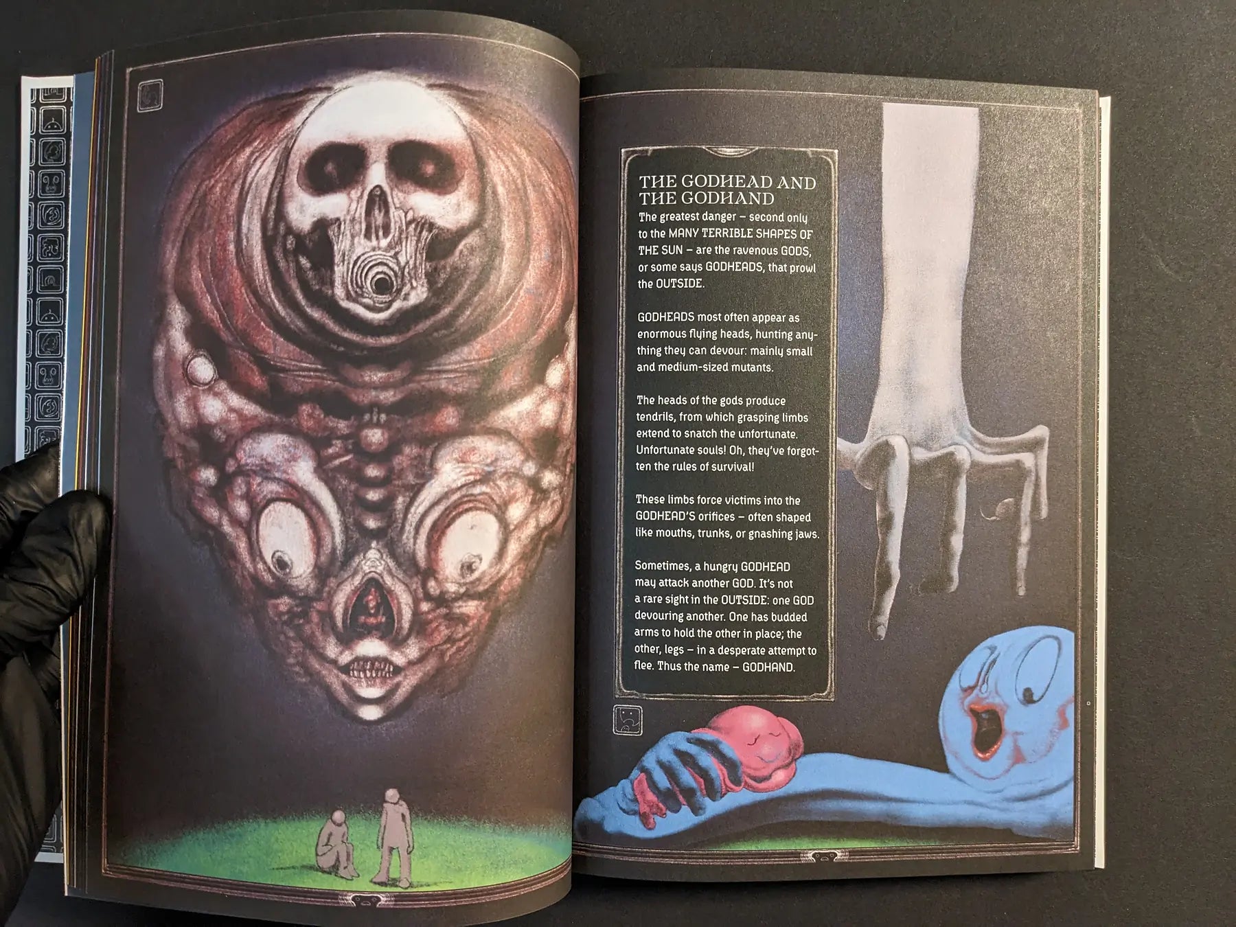 Spread from Bubzium featuring a multi-eyed skull godhead, a pale reaching hand and a blue figure clutching a pink limb.