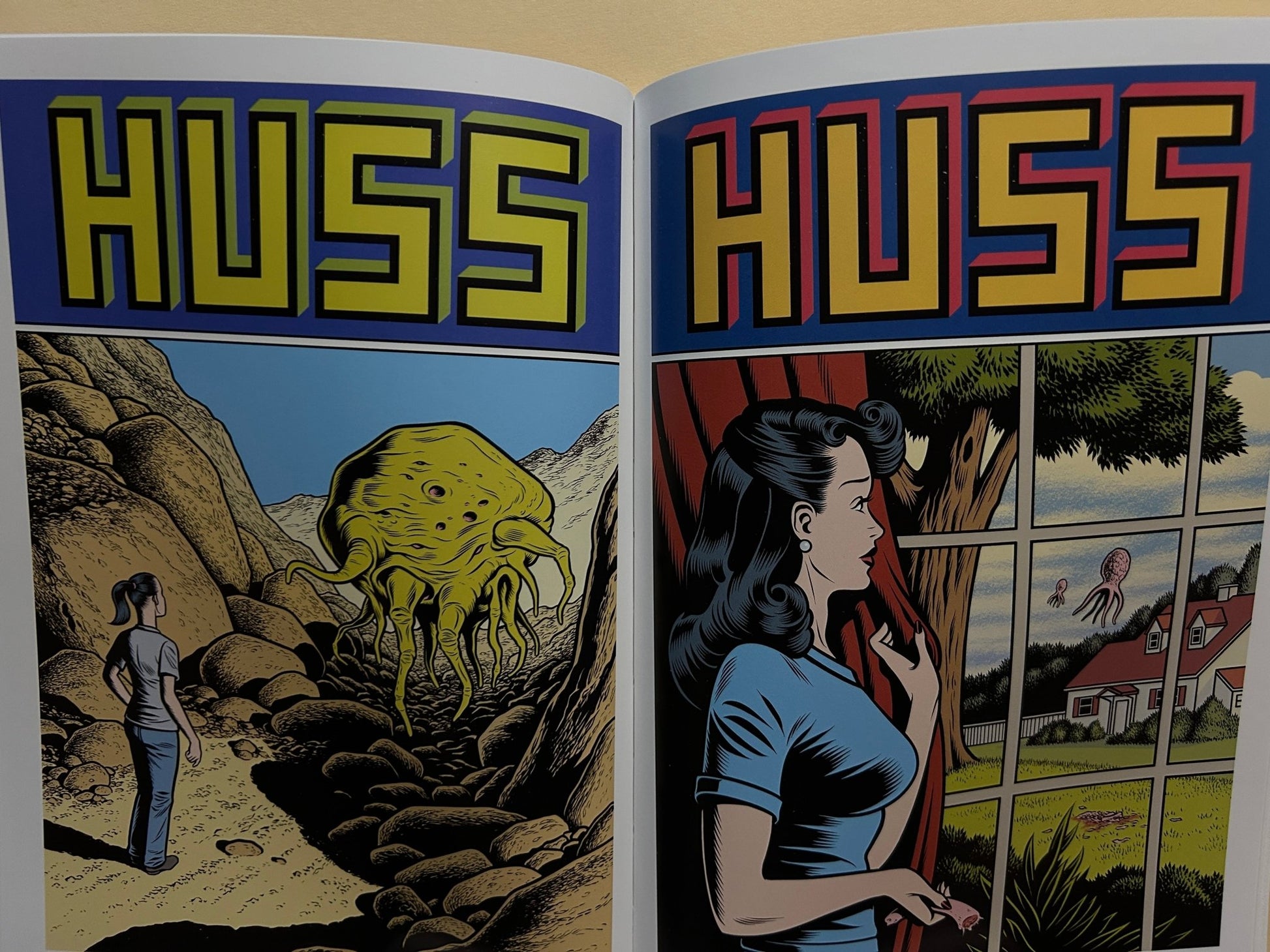 Interior spread from Caprice by Charles Burns with two HUSS covers: a yellow creature in a rocky landscape and a woman by a window.