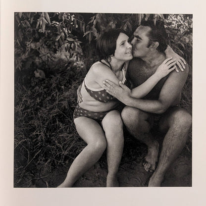 Interior photo from Cheryomushki: black-and-white portrait of a couple embracing in swimwear by the water.