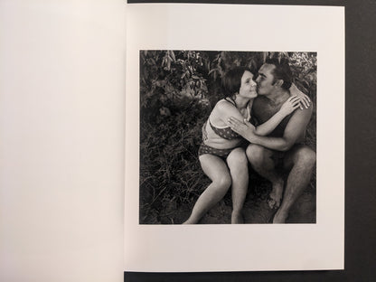 Interior photo from Cheryomushki: black-and-white portrait of a couple embracing in swimwear by the water.