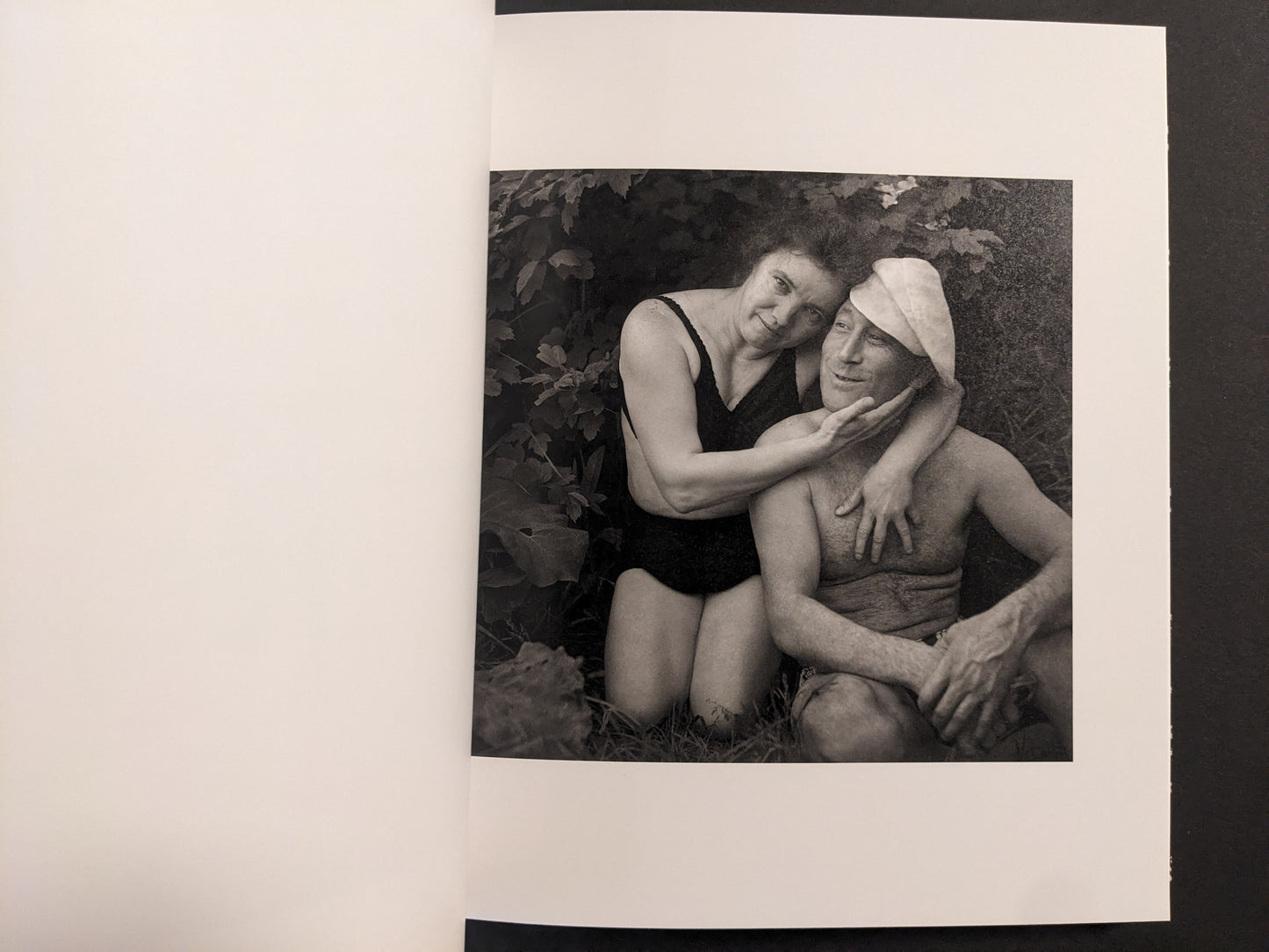 Interior photo from Cheryomushki: black-and-white portrait of a couple in swimwear, posed closely outdoors.