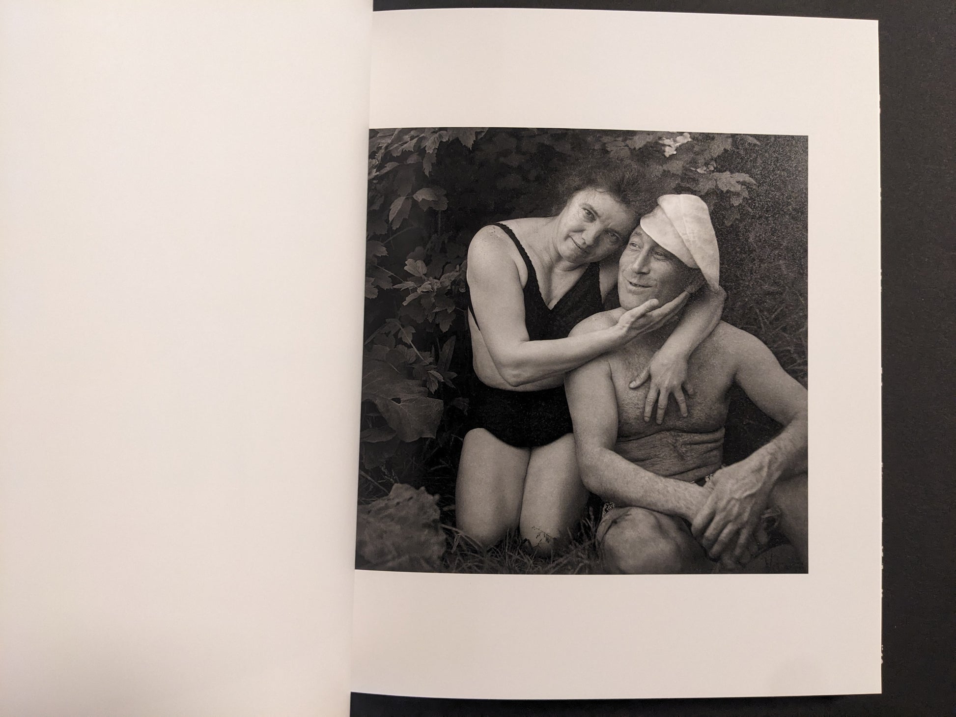 Interior photo from Cheryomushki: black-and-white portrait of a couple in swimwear, posed closely outdoors.
