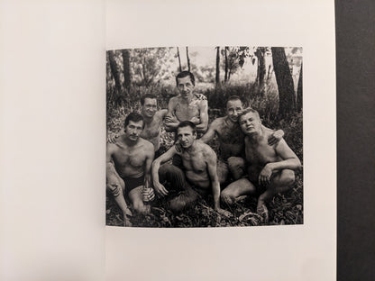 Cheryomushki by Nikolay Bakharev interior photo: black-and-white group portrait of six men resting in the woods, one holding a bottle.
