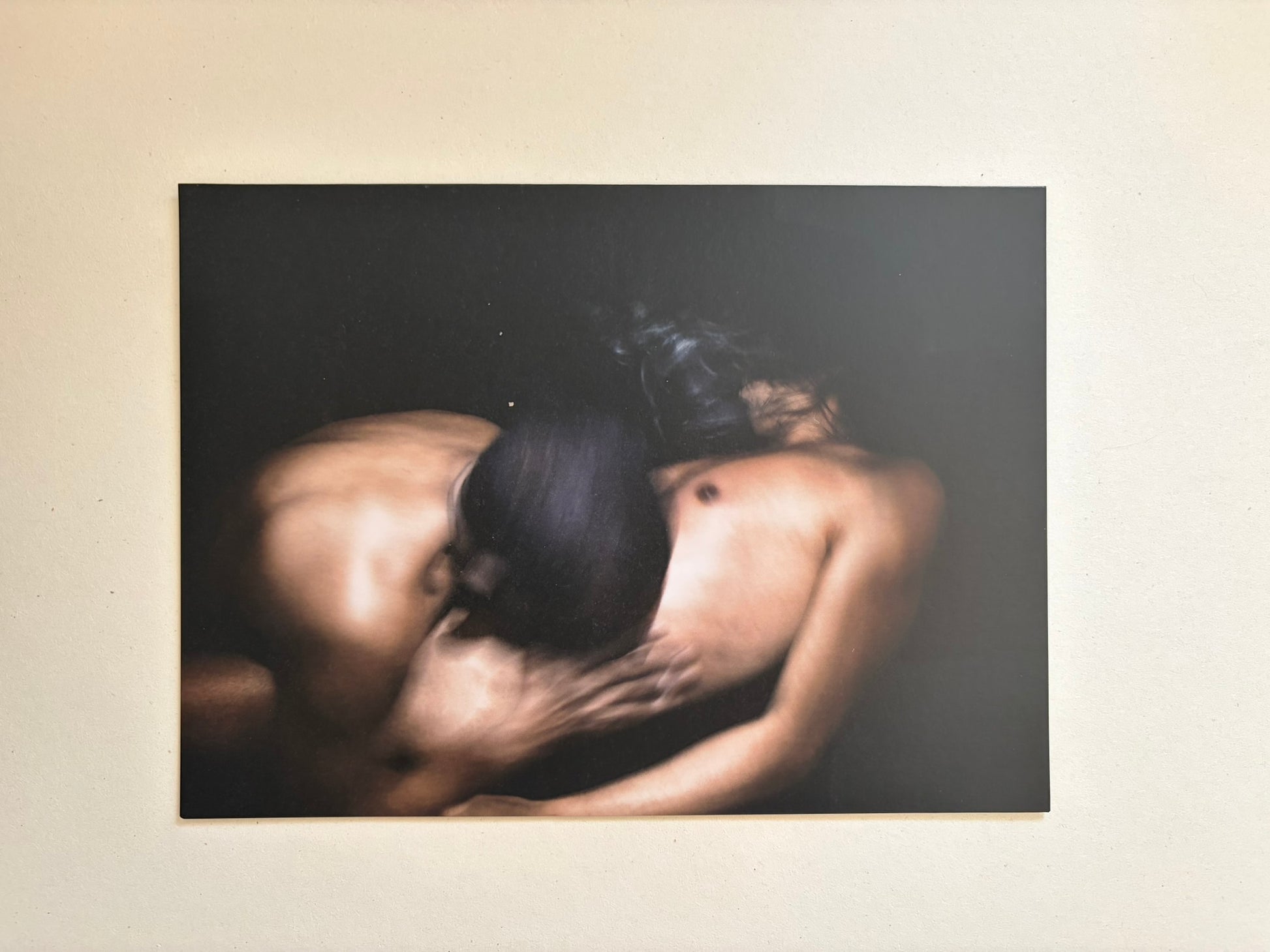 A blurred colour photograph of two nude figures in close contact from Cidade de Pedra.