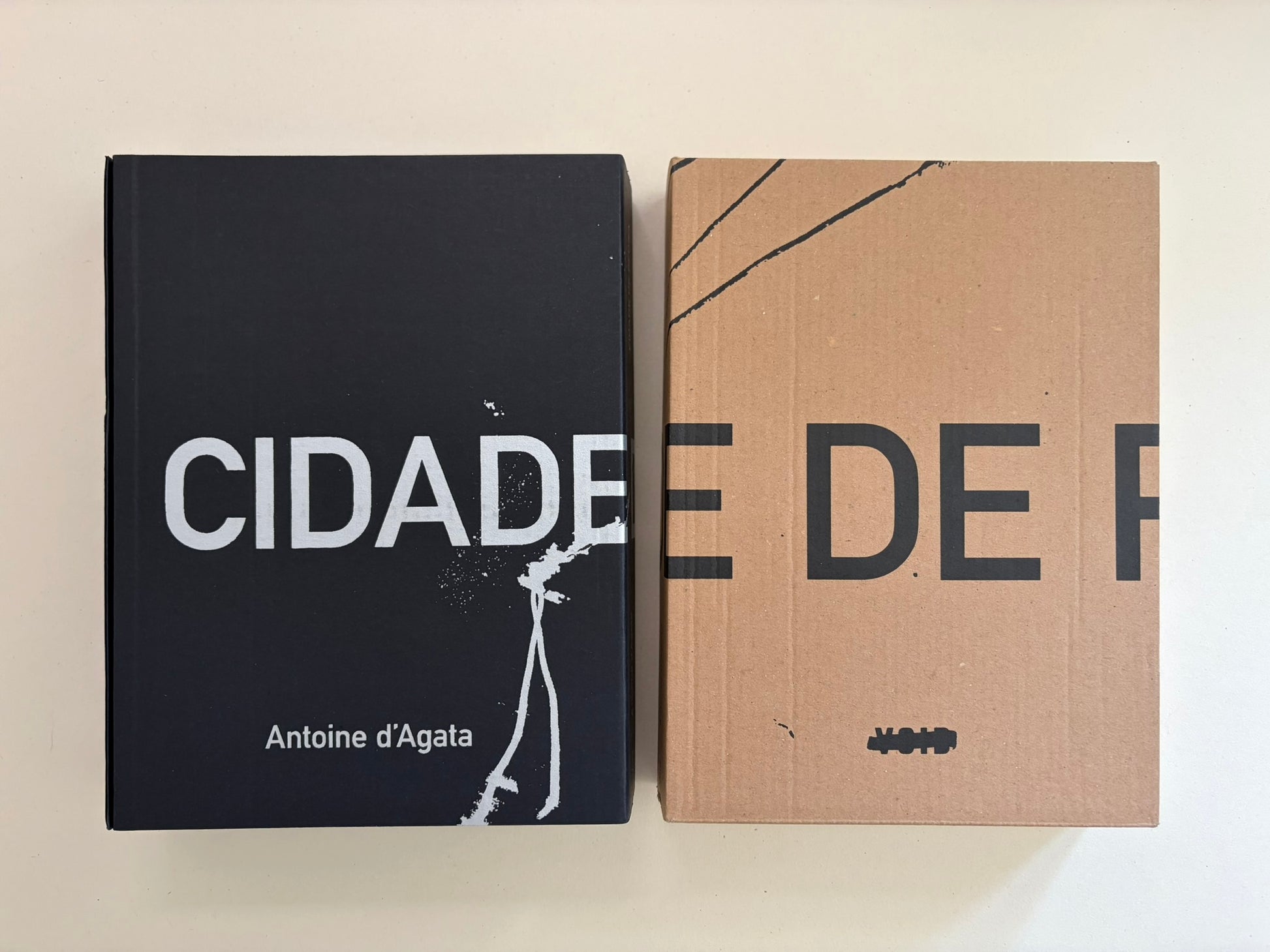 Cidade de Pedra by Antoine d'Agata, book and slipcase shown side by side.