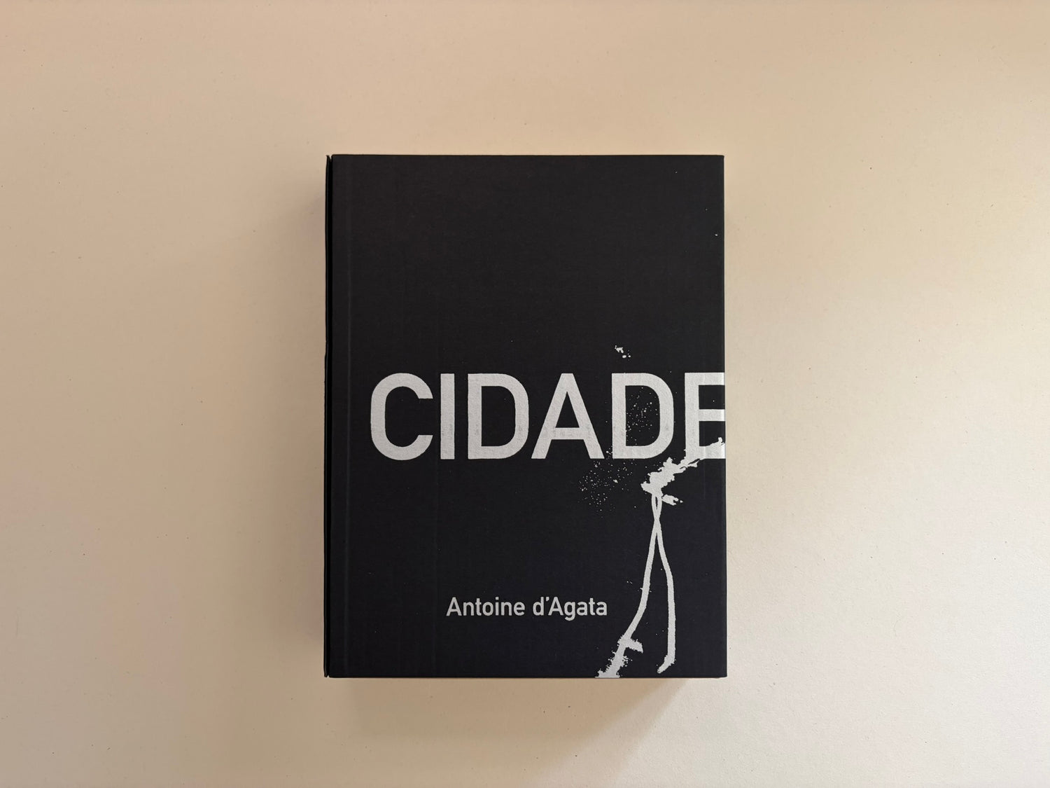 Cidade de Pedra by Antoine d'Agata, front cover on a plain light surface.