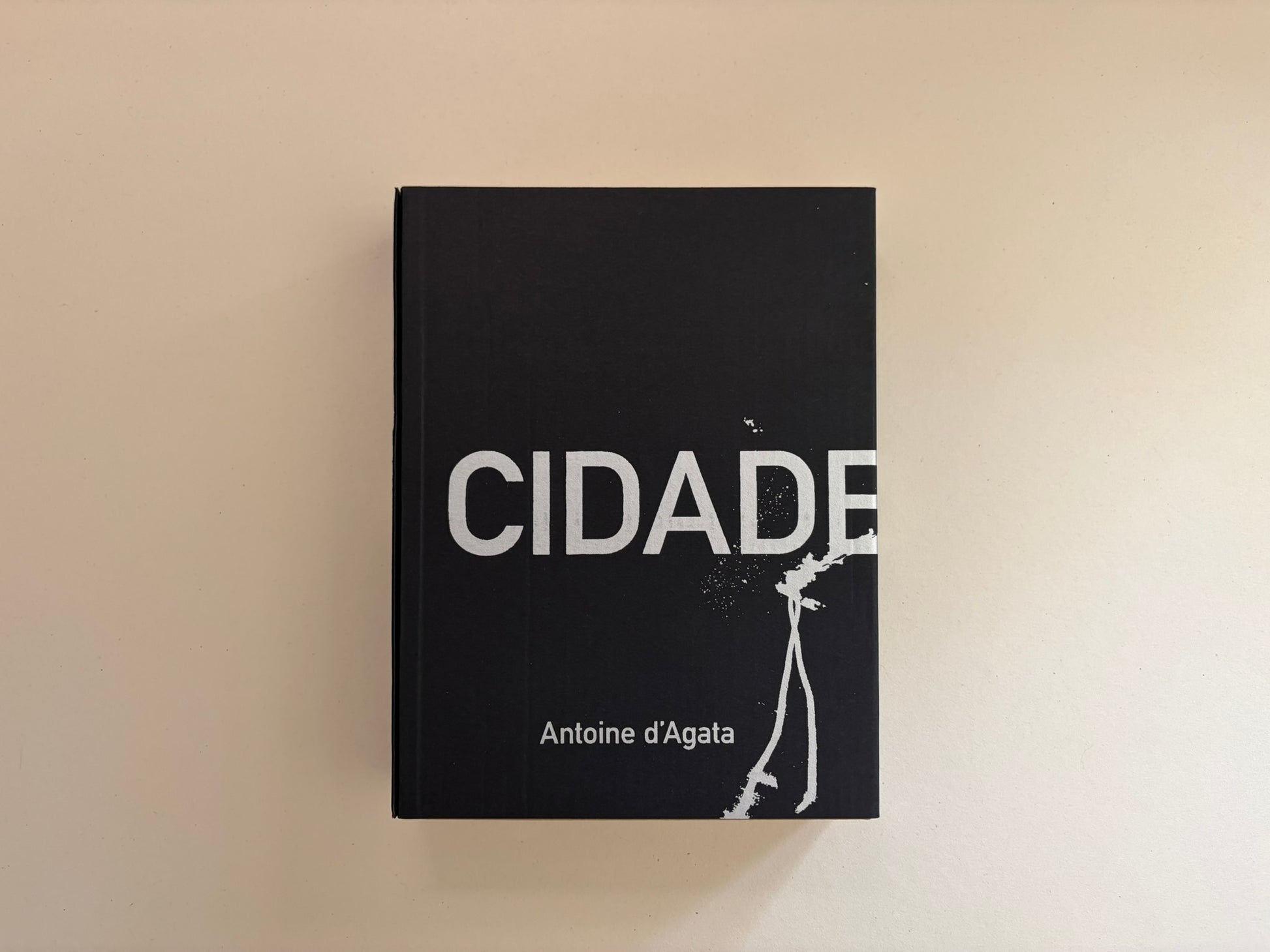 Cidade de Pedra by Antoine d'Agata, front cover on a plain light surface.