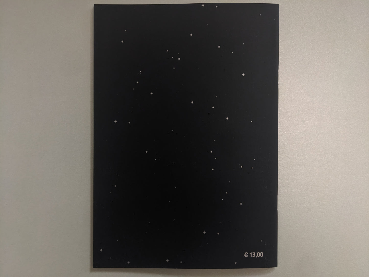 Back cover of Crystal Bone Drive with a starfield design and printed price