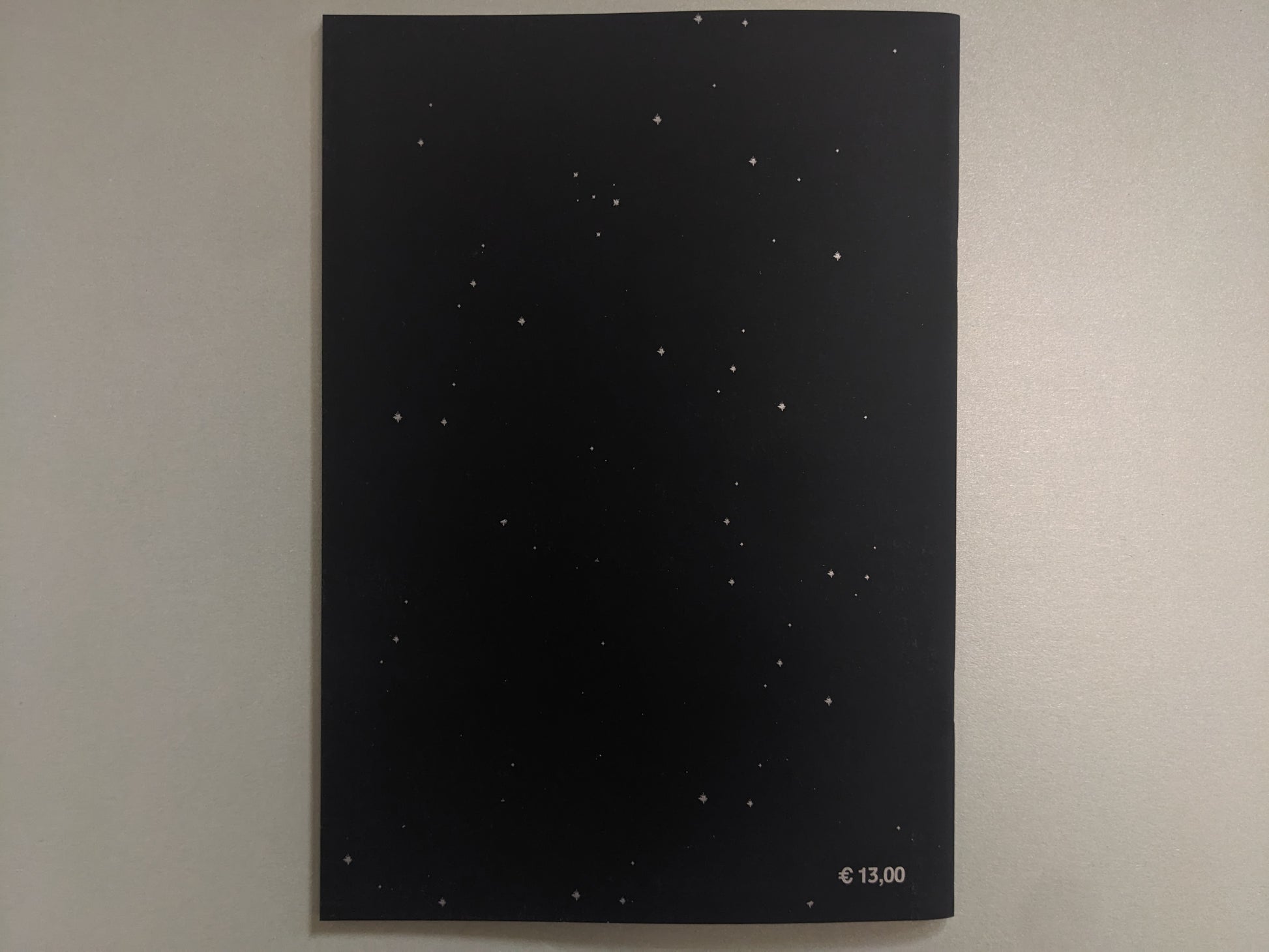 Back cover of Crystal Bone Drive with a starfield design and printed price