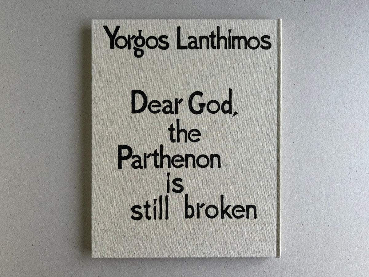Back cover of Dear God, the Parthenon is still broken by Yorgos Lanthimos, showing the title on a cloth hardcover.