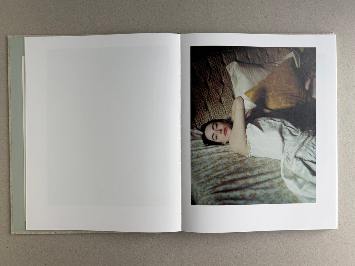 Open spread with a colour photograph on the right page and a blank left page in Dear God, the Parthenon is still broken.