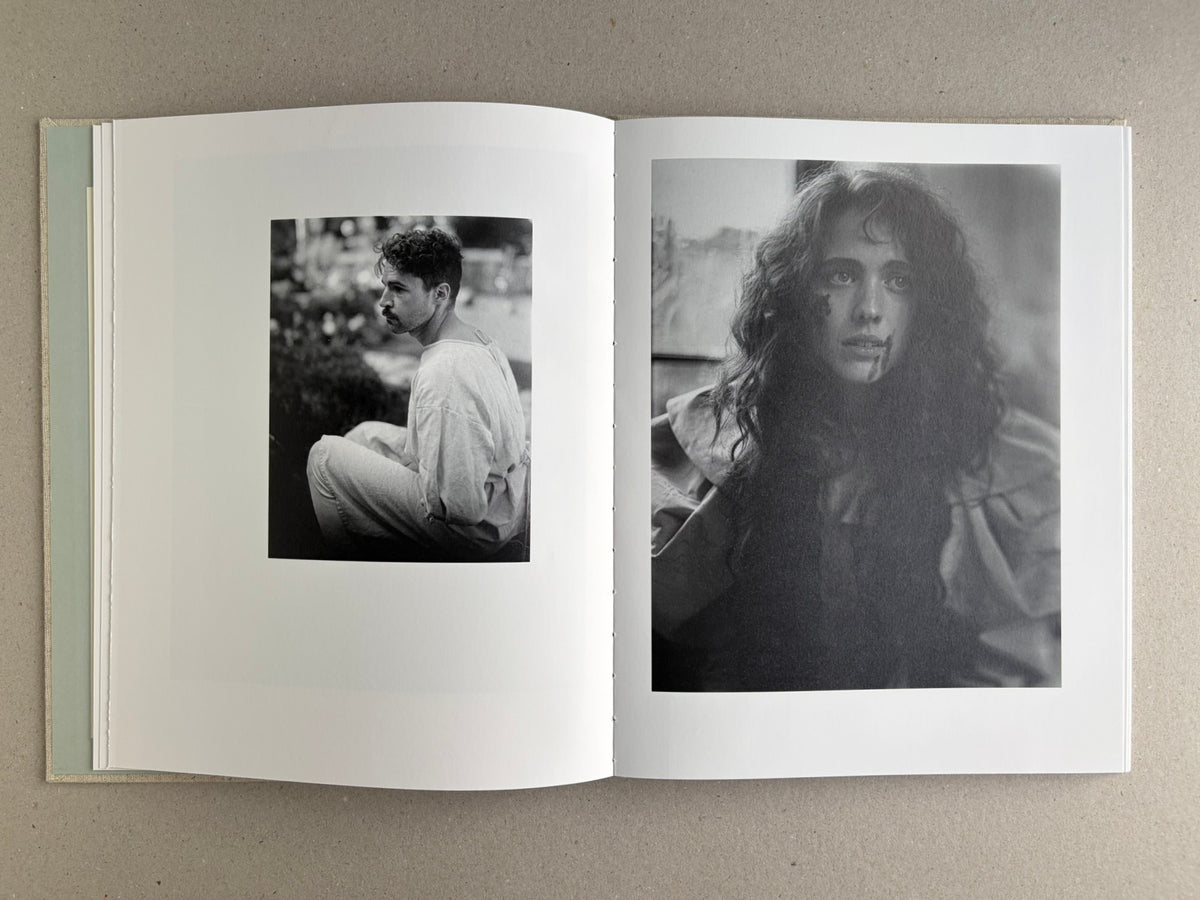 Open spread with a black-and-white portrait on the left and a black-and-white studio scene on the right in Dear God, the Parthenon is still broken.