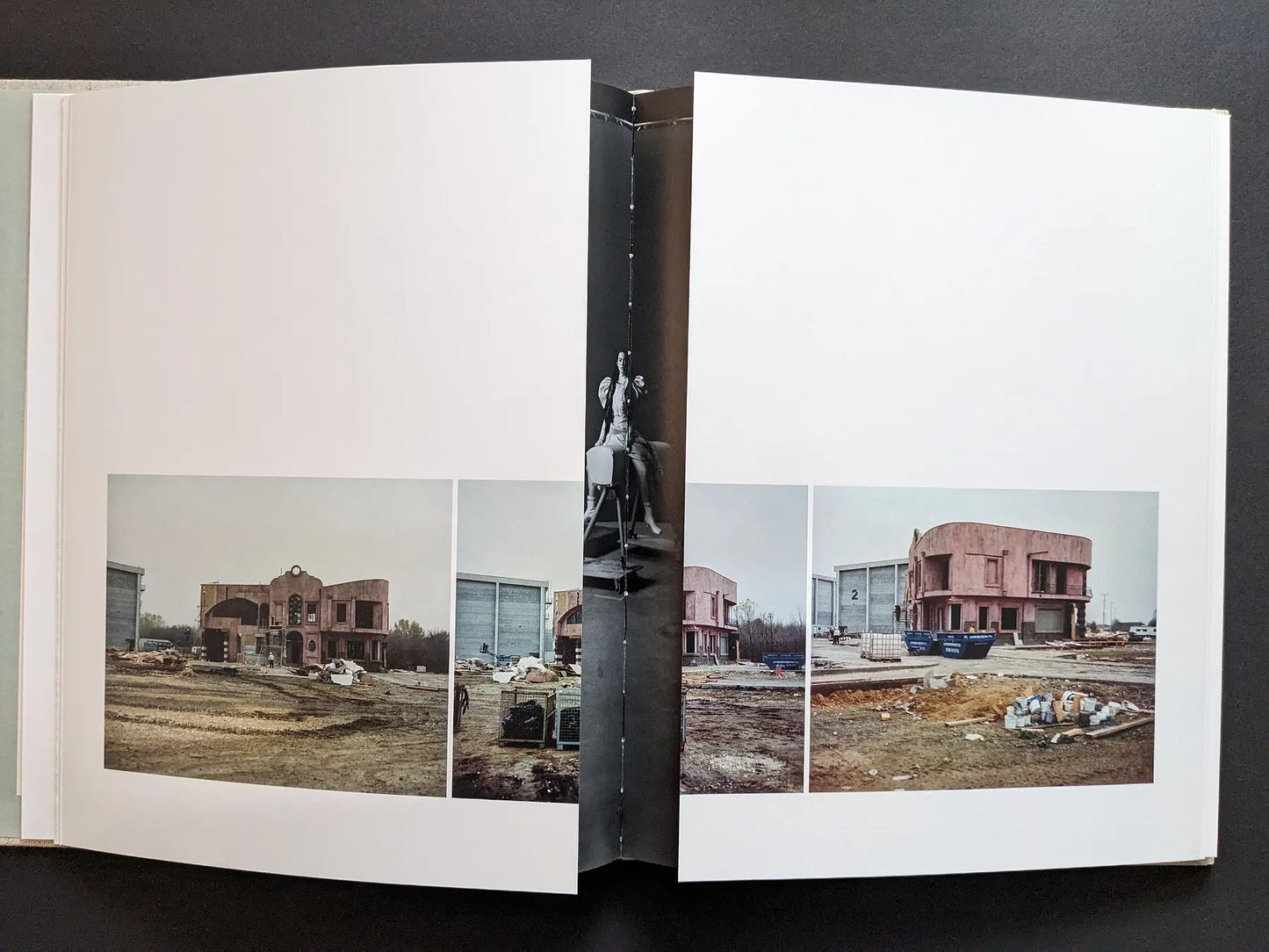 Gatefold revealing constructed house facades on a film set.