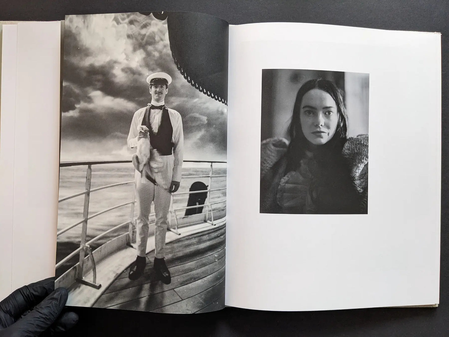 Gatefold with a sailor on a ship deck and a close portrait of a female character in black and white.